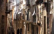 Narrow streets and lights of dusk or dawn / ALC.